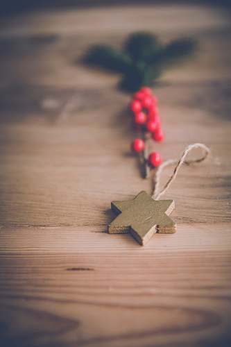 wooden desk selective focus photography of star pendant christmas party